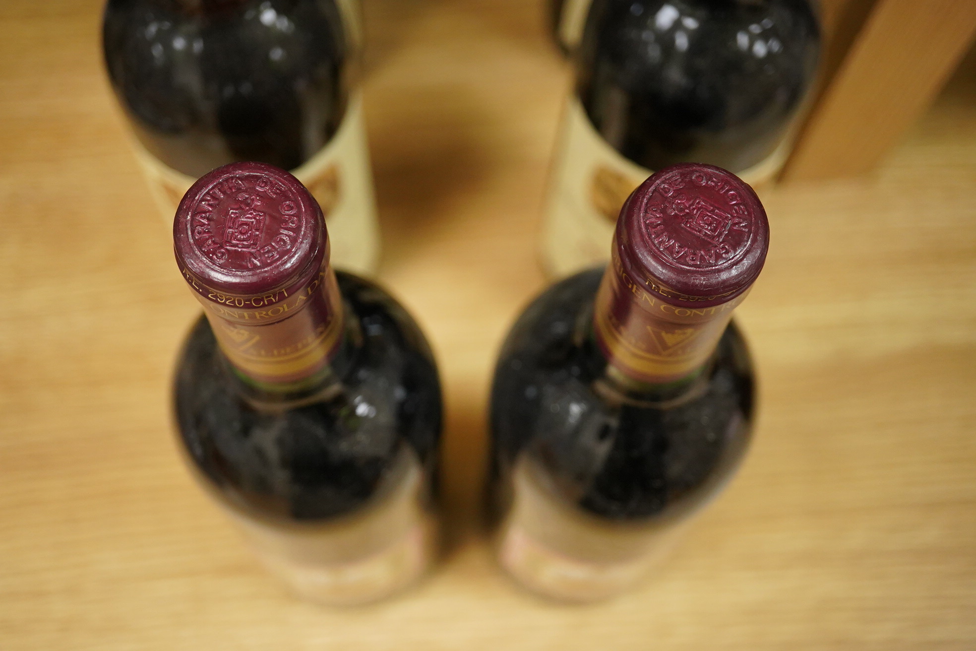 An early 20th century carved oak mantel clock, with key and pendulum, 58cm high